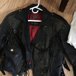 There leather jackets, vests, other items